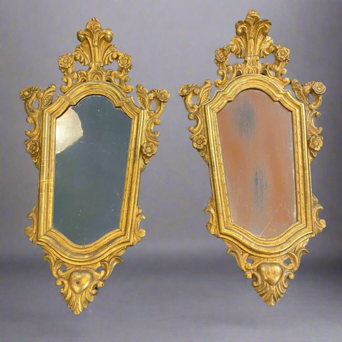 Antique pair of carved mirrors