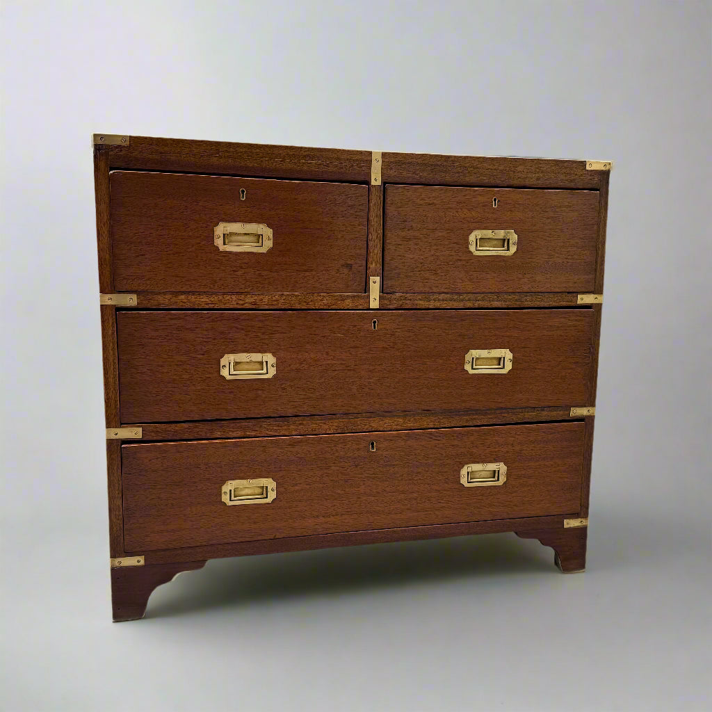 Small campaign style brass bound chest of drawers 