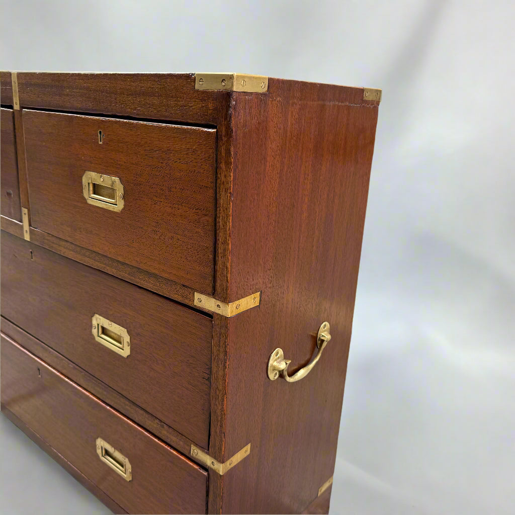 Small campaign style brass bound chest of drawers 