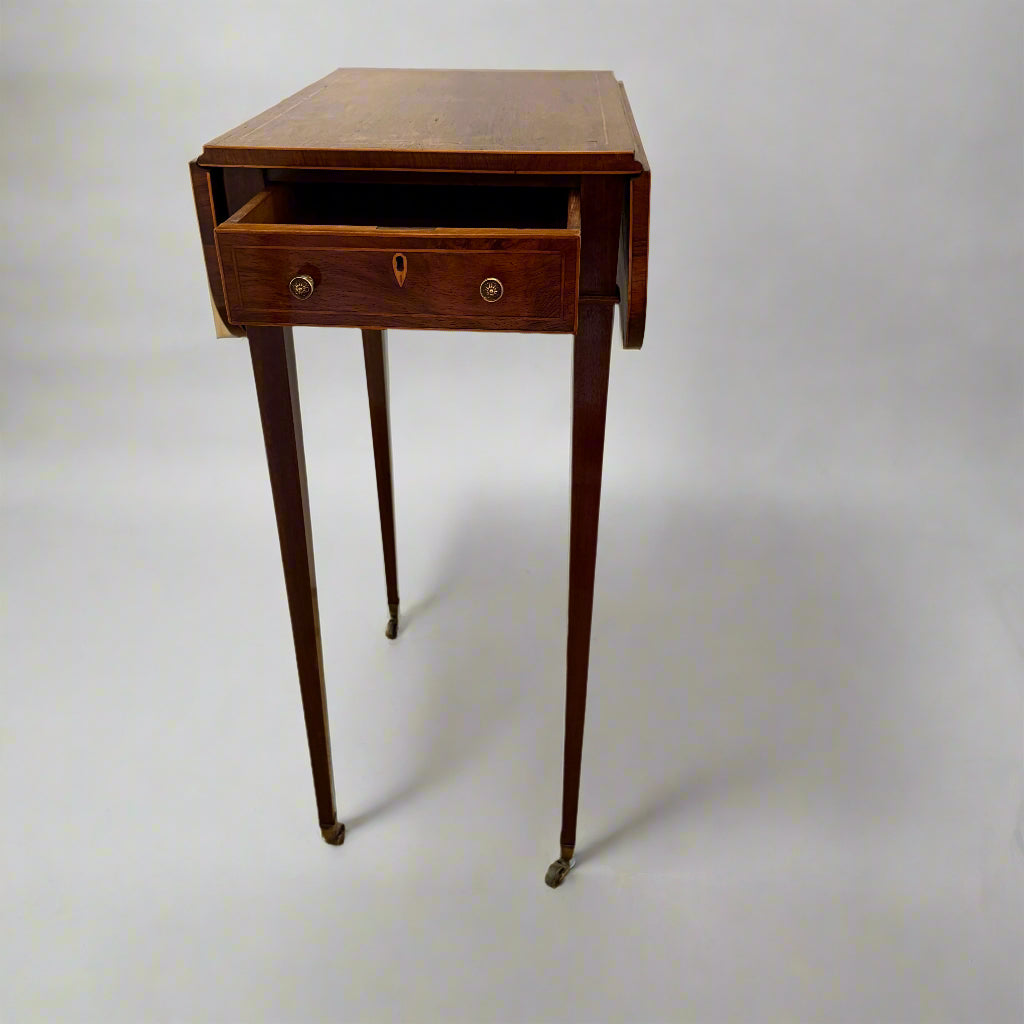 Regency rosewood work table on square tapering legs and castors 