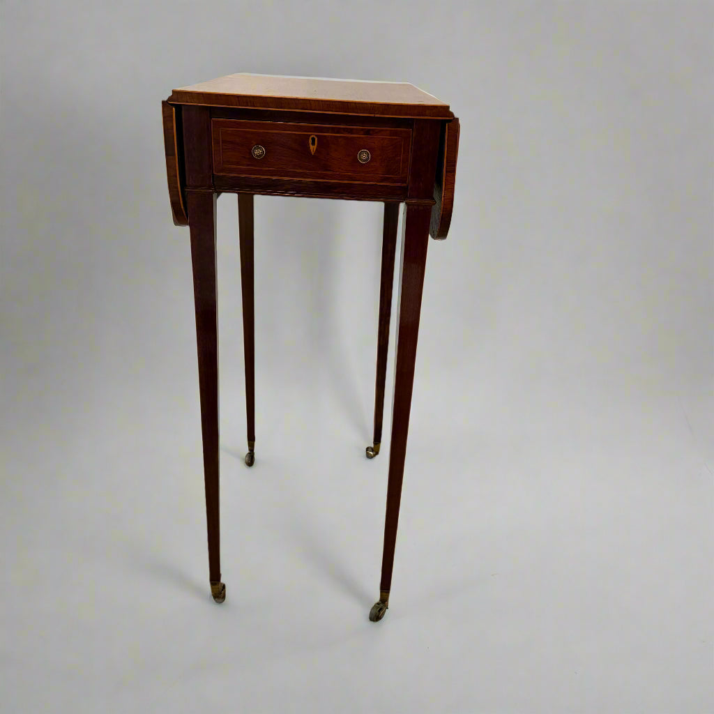 Regency rosewood work table on square tapering legs and castors 