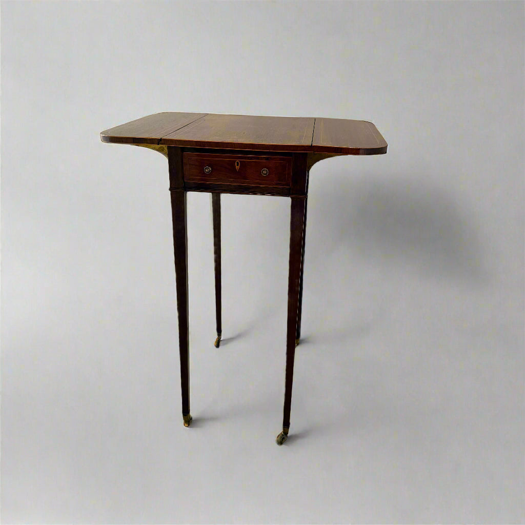 Regency rosewood work table on square tapering legs and castors 