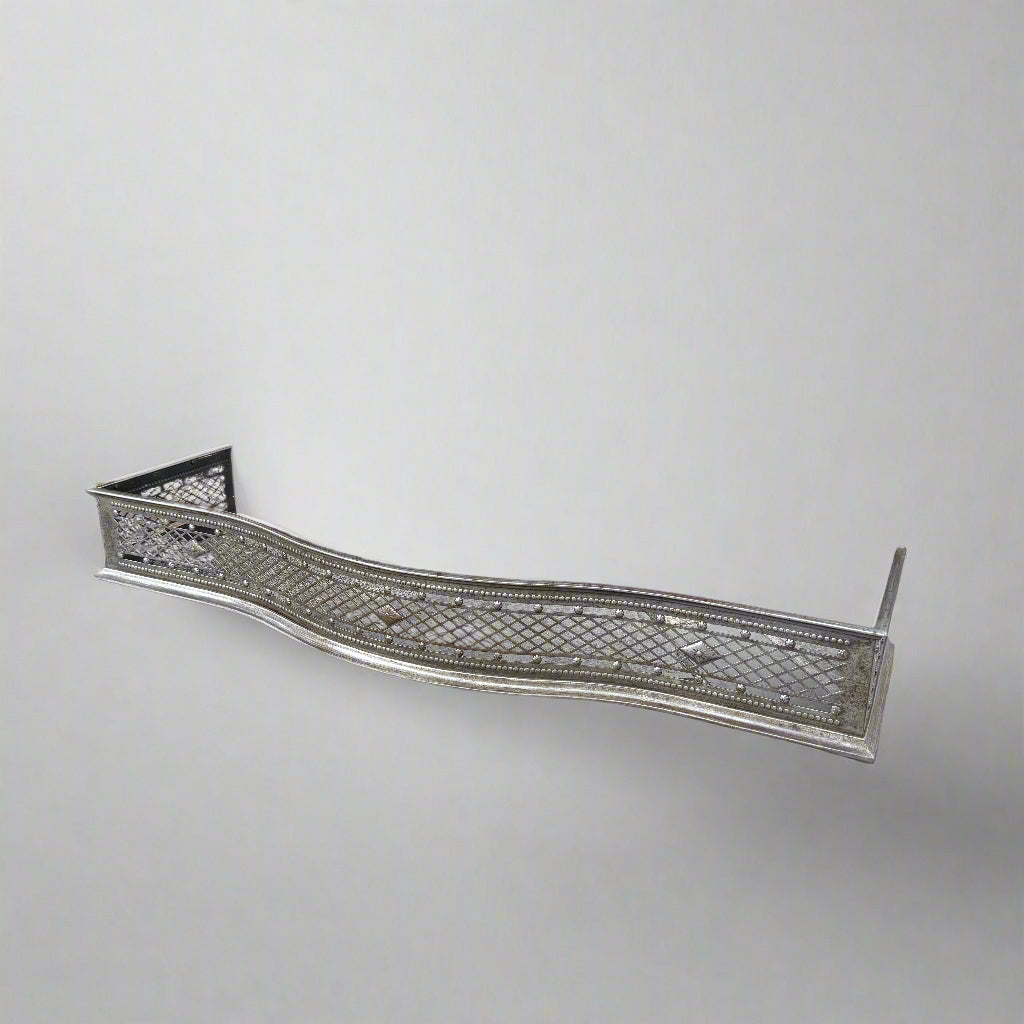 Antique serpentine shaped latice-pierced steel fender 