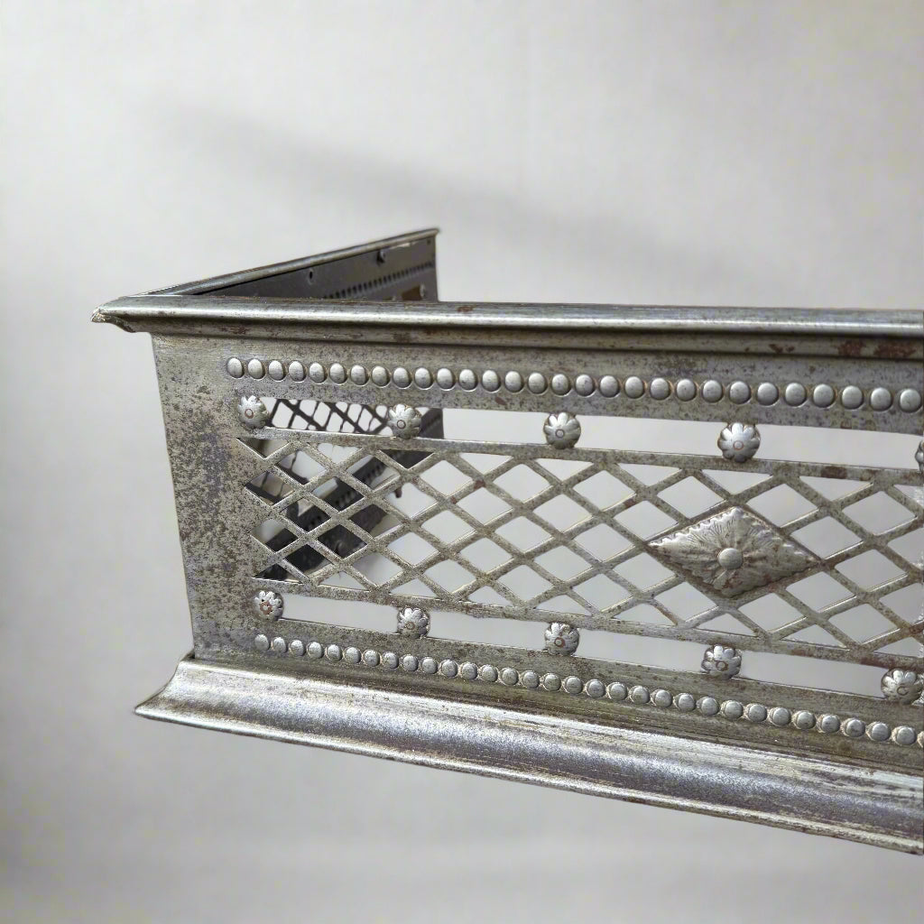 Antique serpentine shaped latice-pierced steel fender 