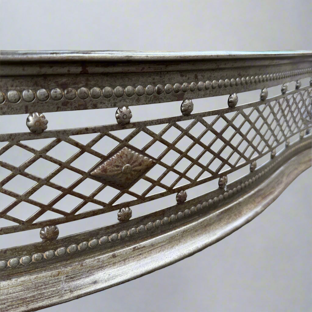 Antique serpentine shaped latice-pierced steel fender 