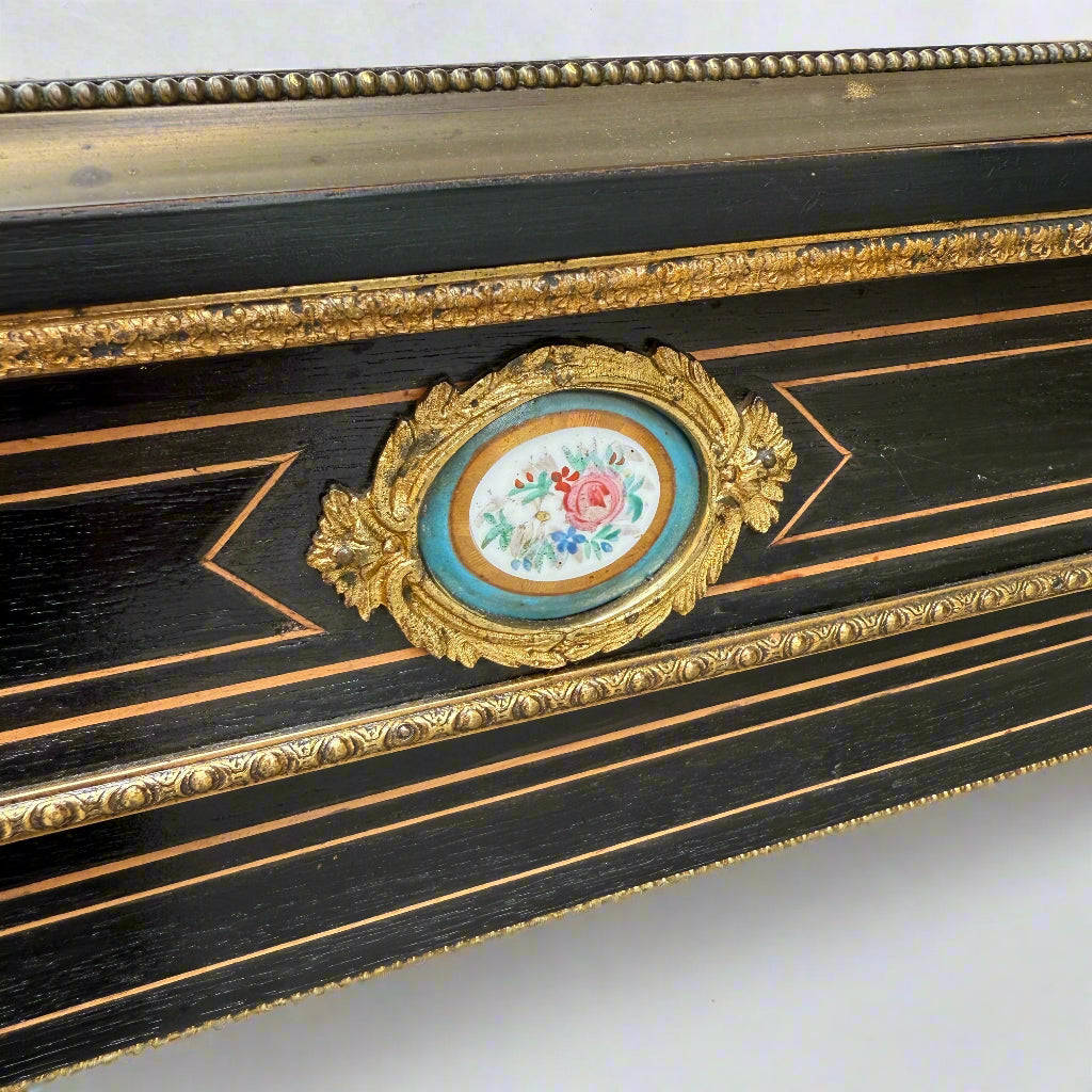 Victorian ebonised and gilt metal mounted pier cabinet with porcelain floral plaque 
