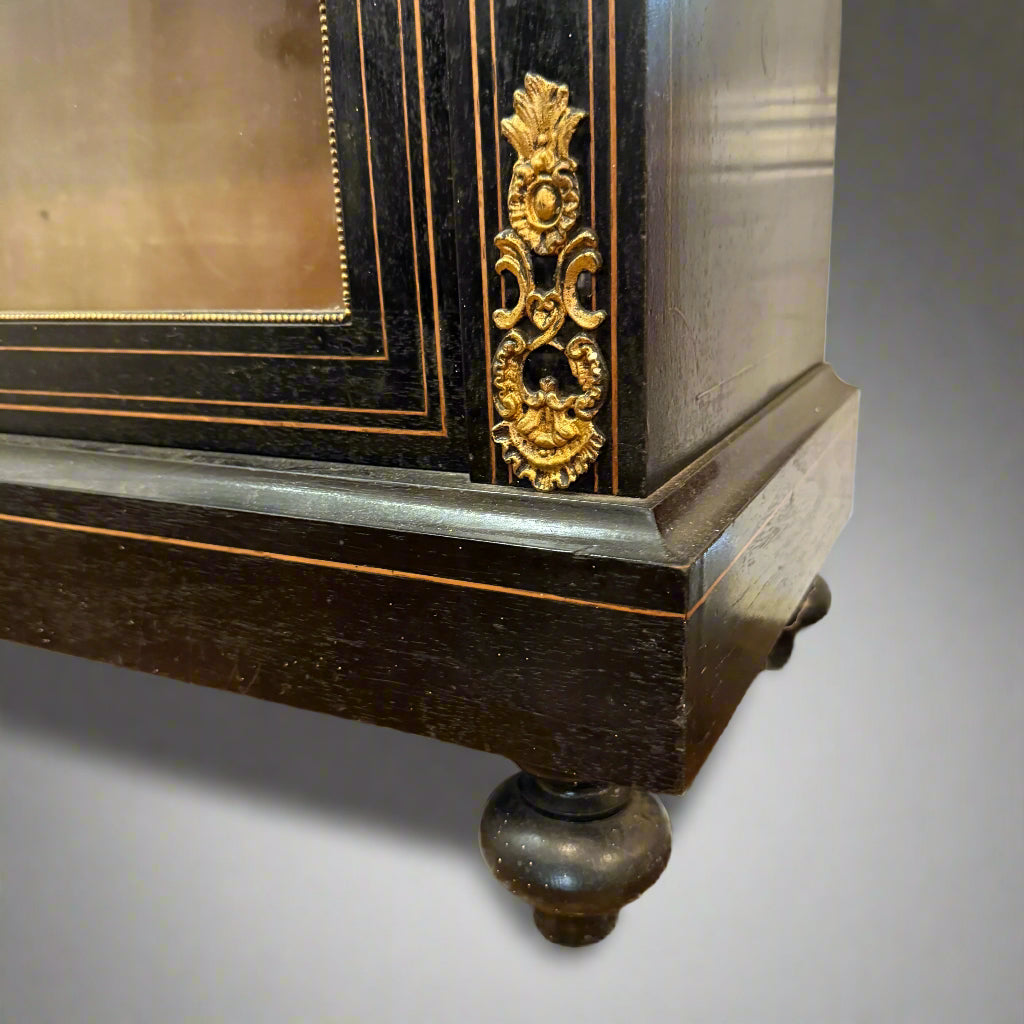 Victorian ebonised and gilt metal mounted pier cabinet with porcelain floral plaque 