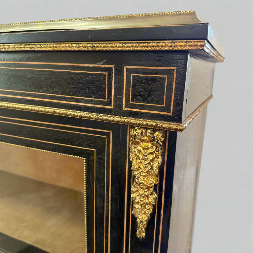 Victorian ebonised and gilt metal mounted pier cabinet with porcelain floral plaque 