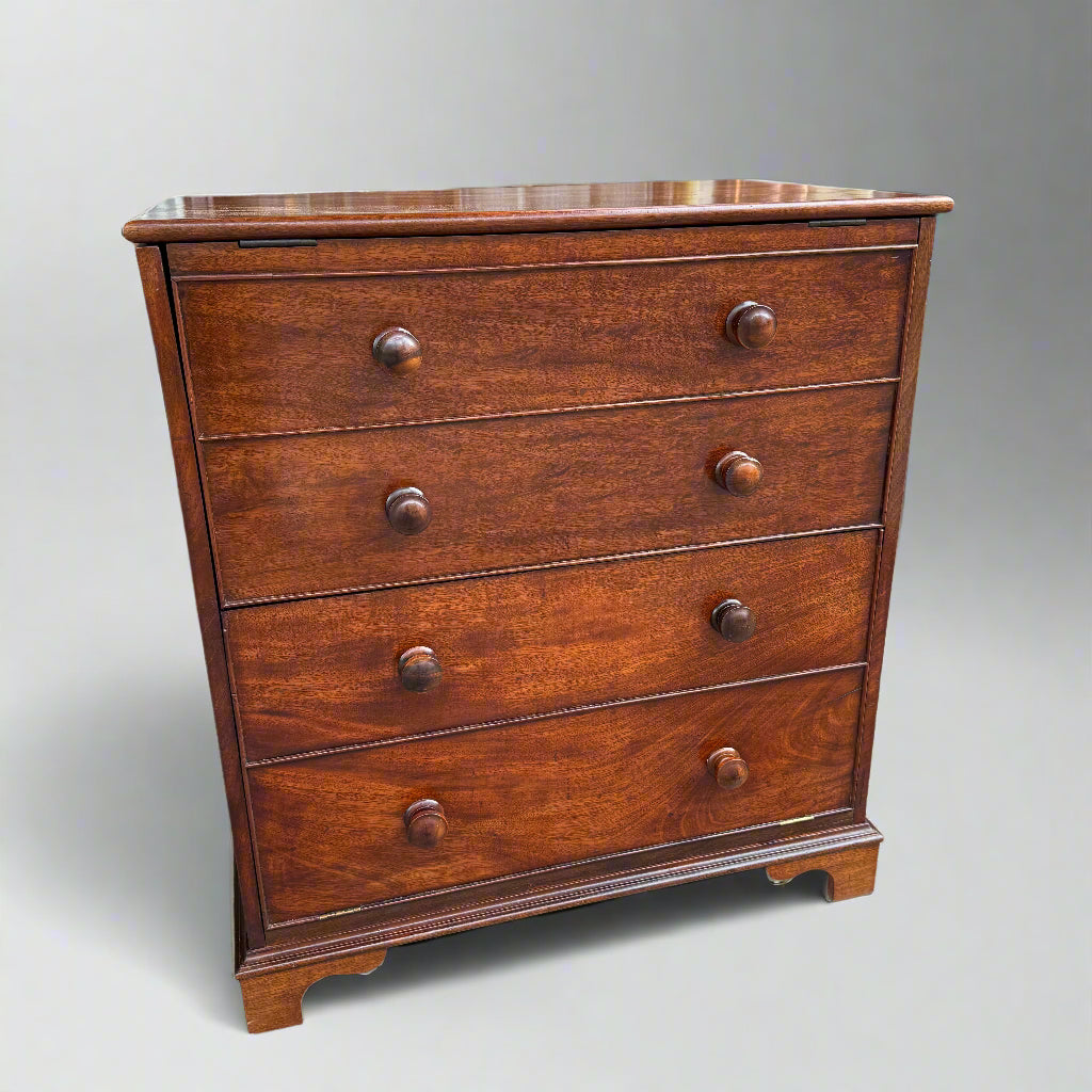 Early 20th century small mahogany cupboard in the form of a four-drawer chest with drop down and lift up doors