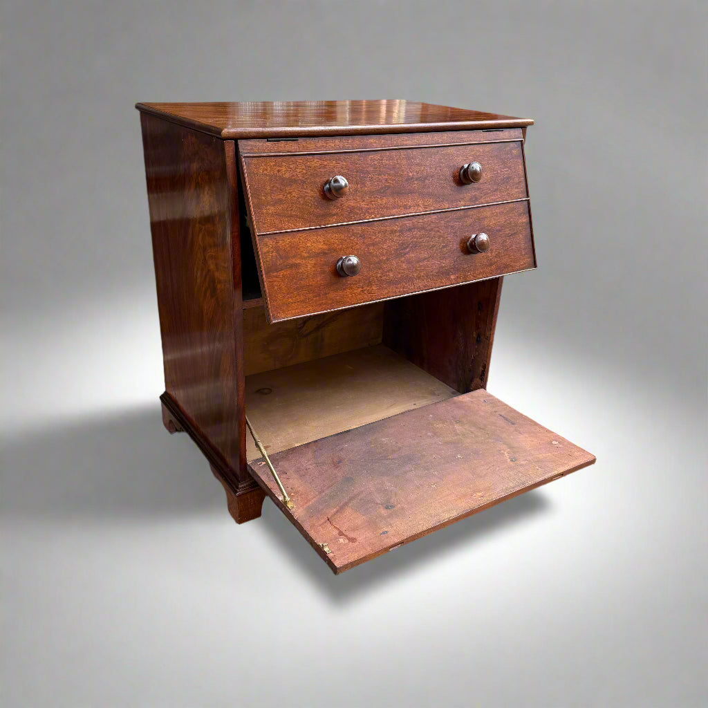 Early 20th century small mahogany cupboard in the form of a four-drawer chest with drop down and lift up doors