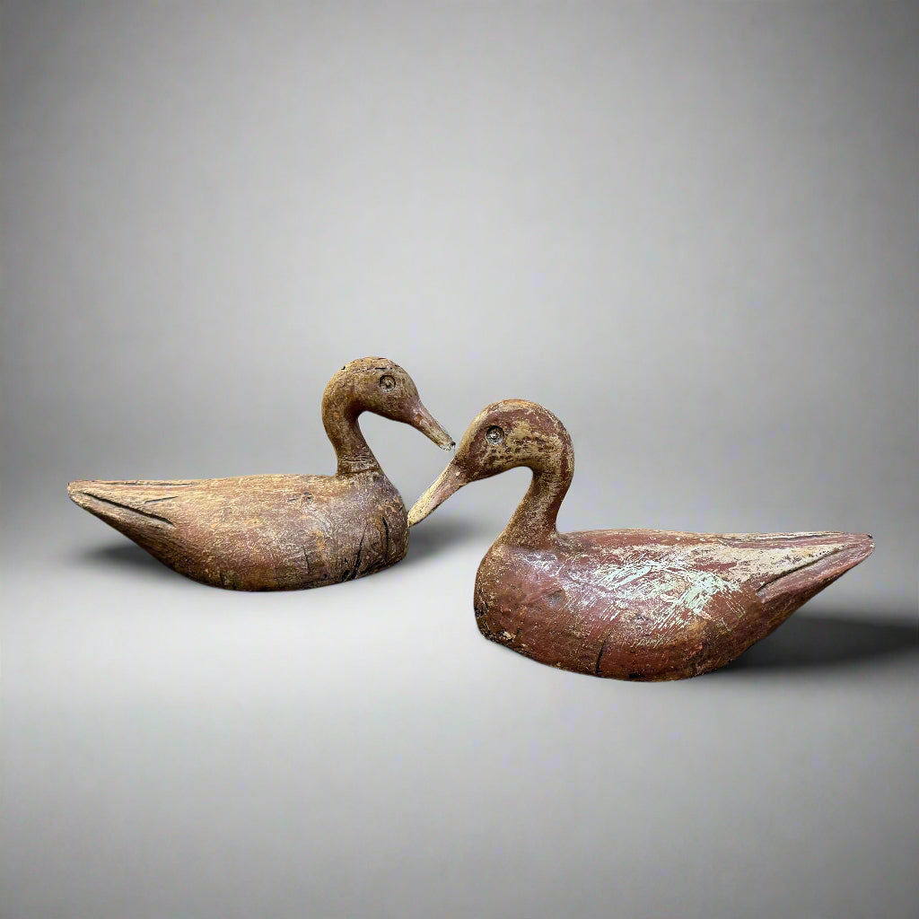 Early 20th century pair of carved wooden duck decoys probably Indian 