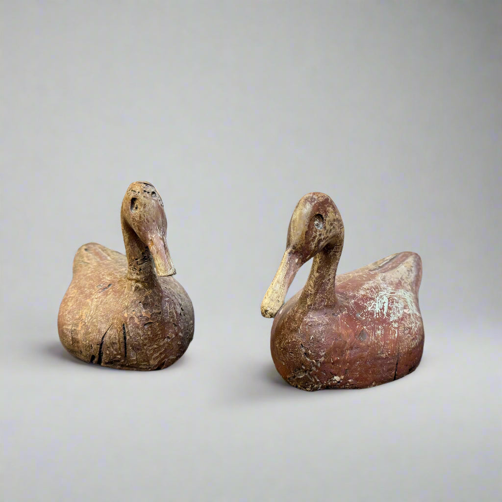 Early 20th century pair of carved wooden duck decoys probably Indian 