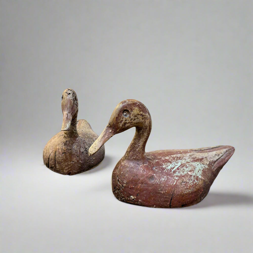 Early 20th century pair of carved wooden duck decoys probably Indian 
