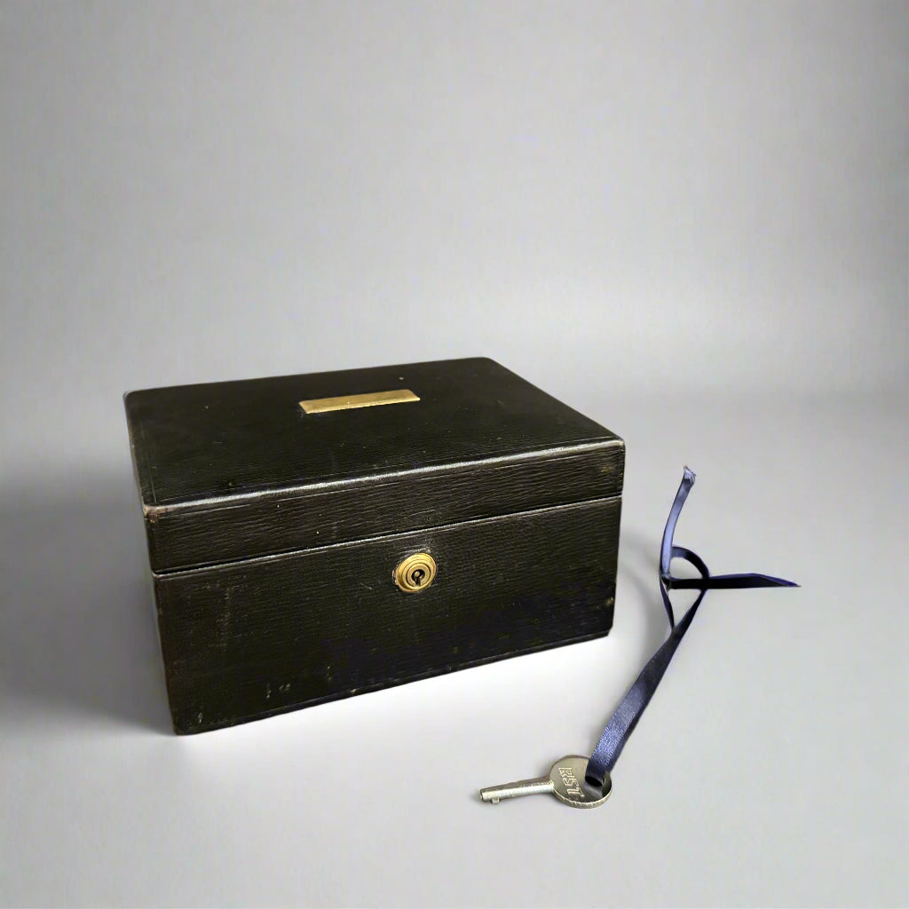 Early 20th century black leather jewellery box 