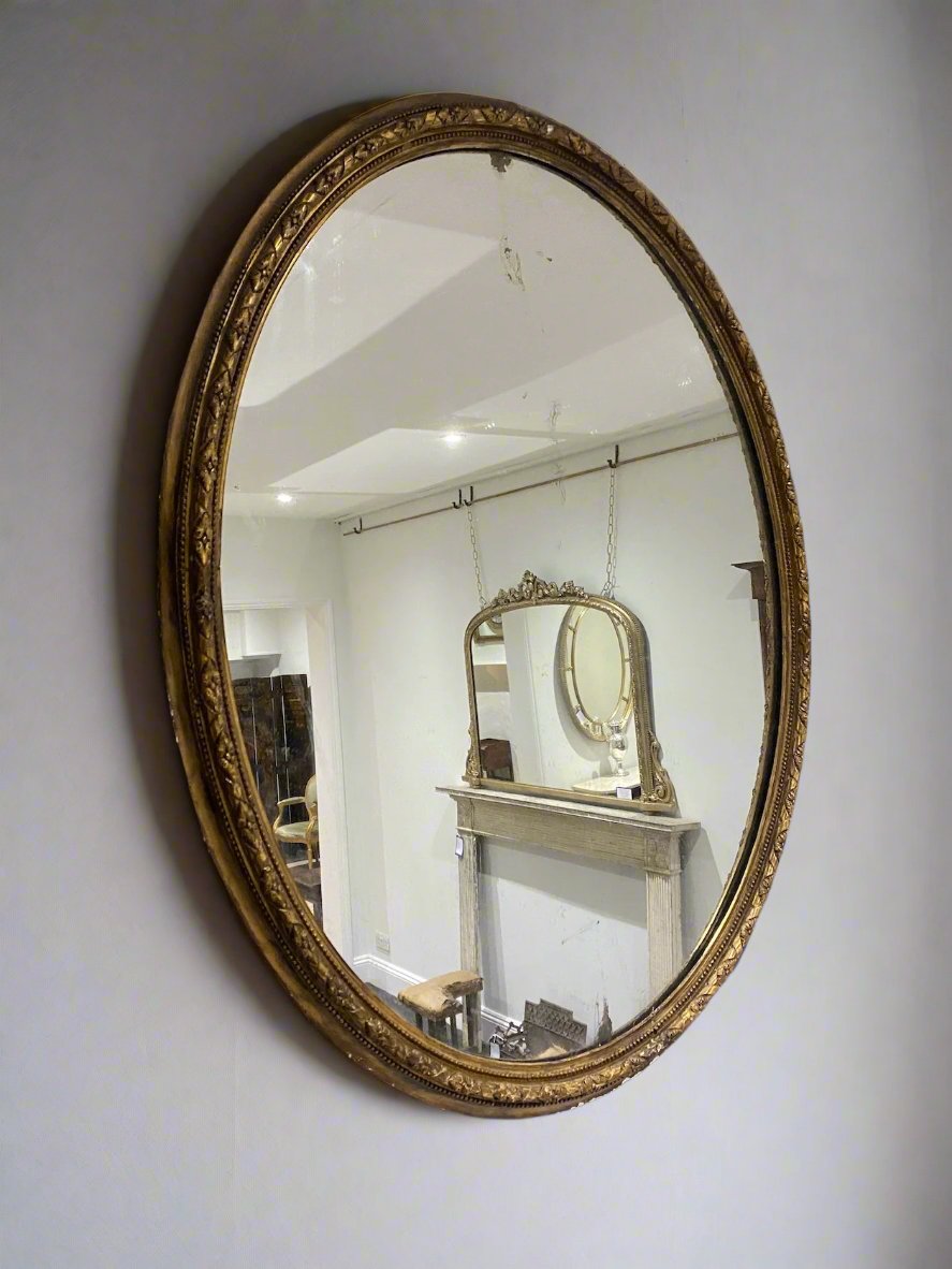 Gilt oval mirror