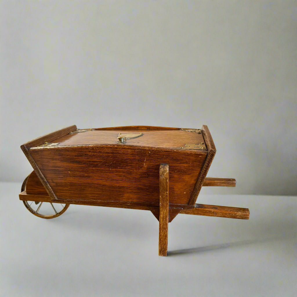 19th century oak brass-bound humidor in the shape of a wheelbarrow 