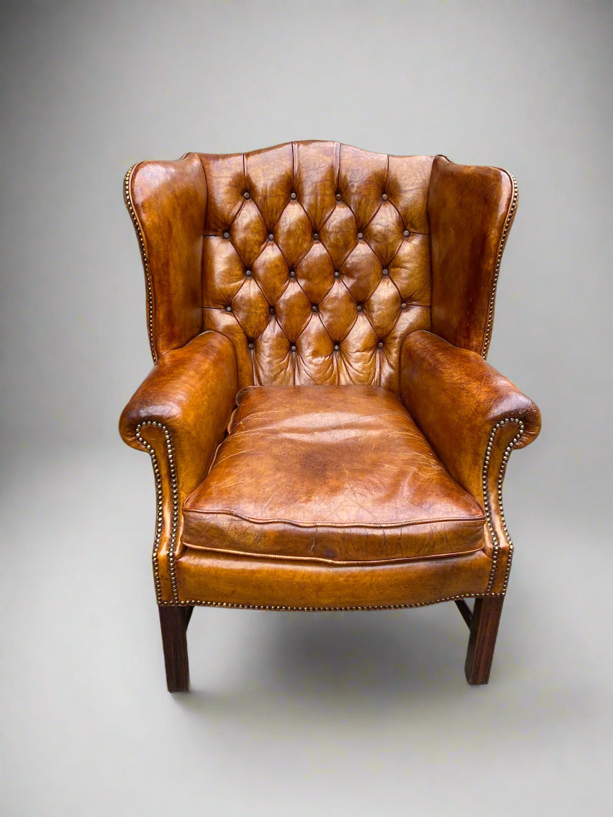 George VI leather button back wingchair circa 1940s