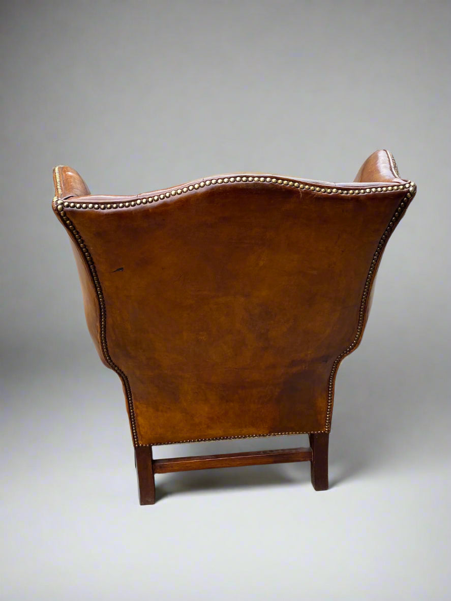 George VI leather button back wingchair circa 1940s
