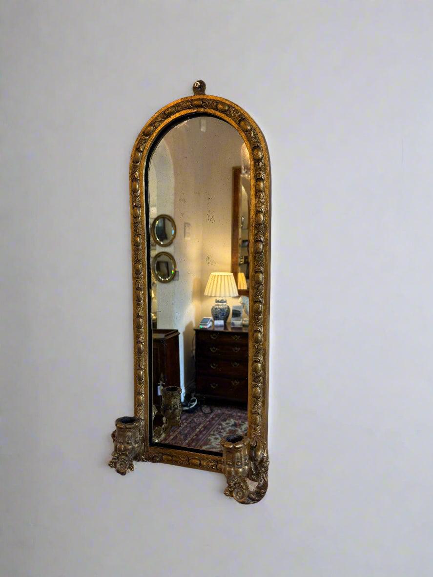 Pair of late 19th century gilt wall mirrors with carved candle holders and carved frame arched top 