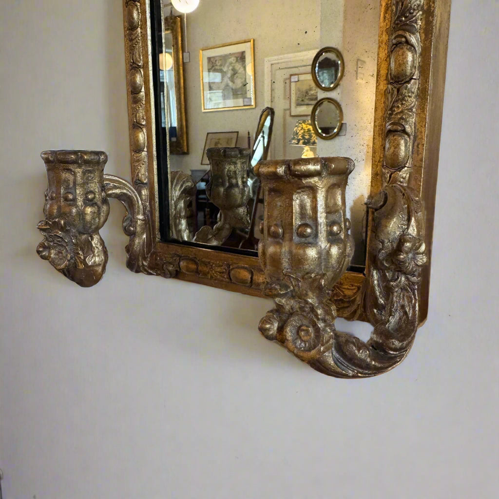 Pair of late 19th century gilt wall mirrors with carved candle holders and carved frame arched top 