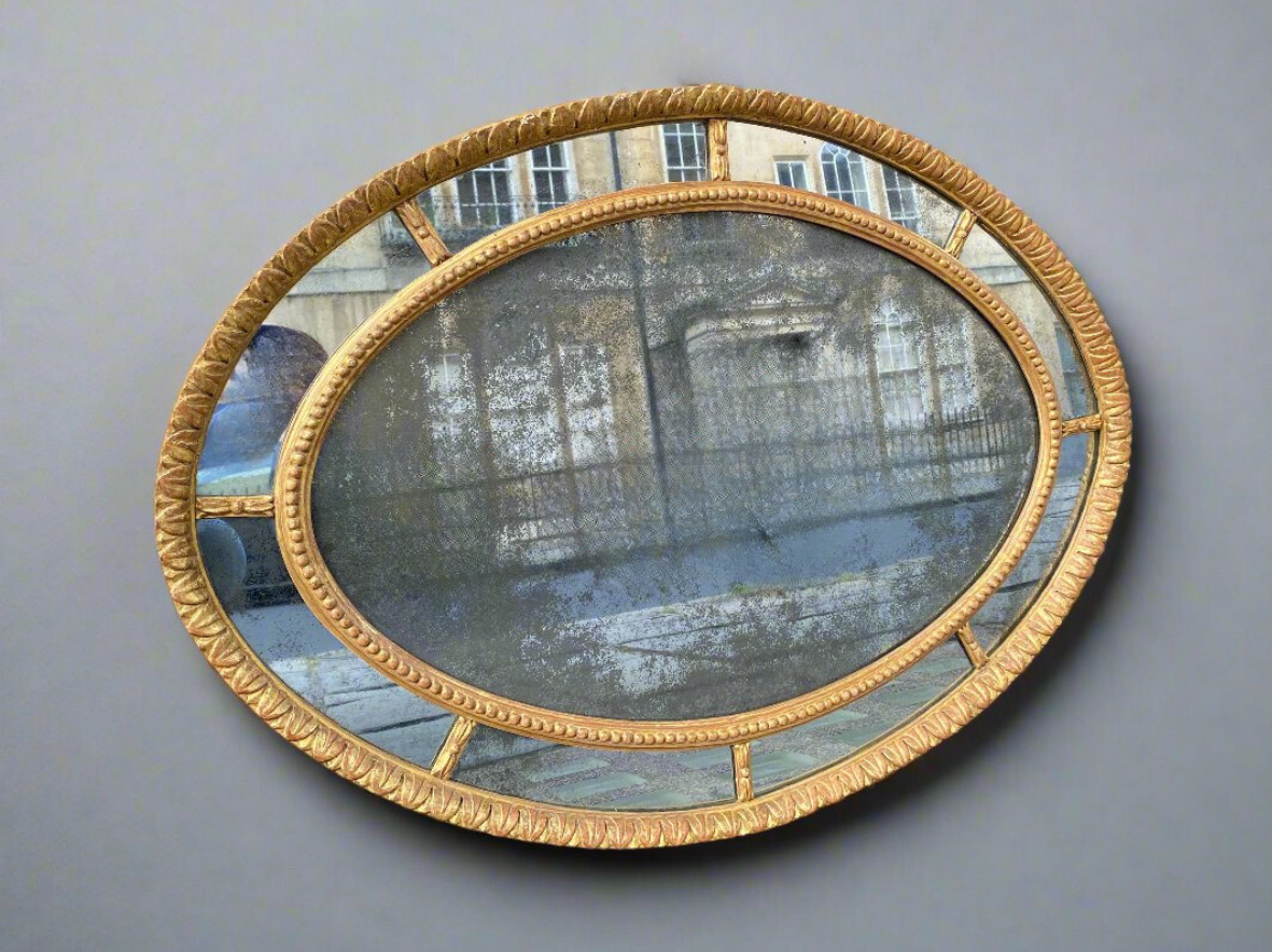 antique oval giltwood mirror