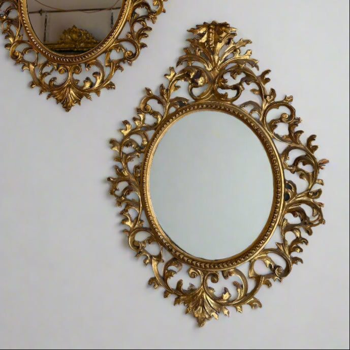 Pair of 19th century oval Florentine mirrors 