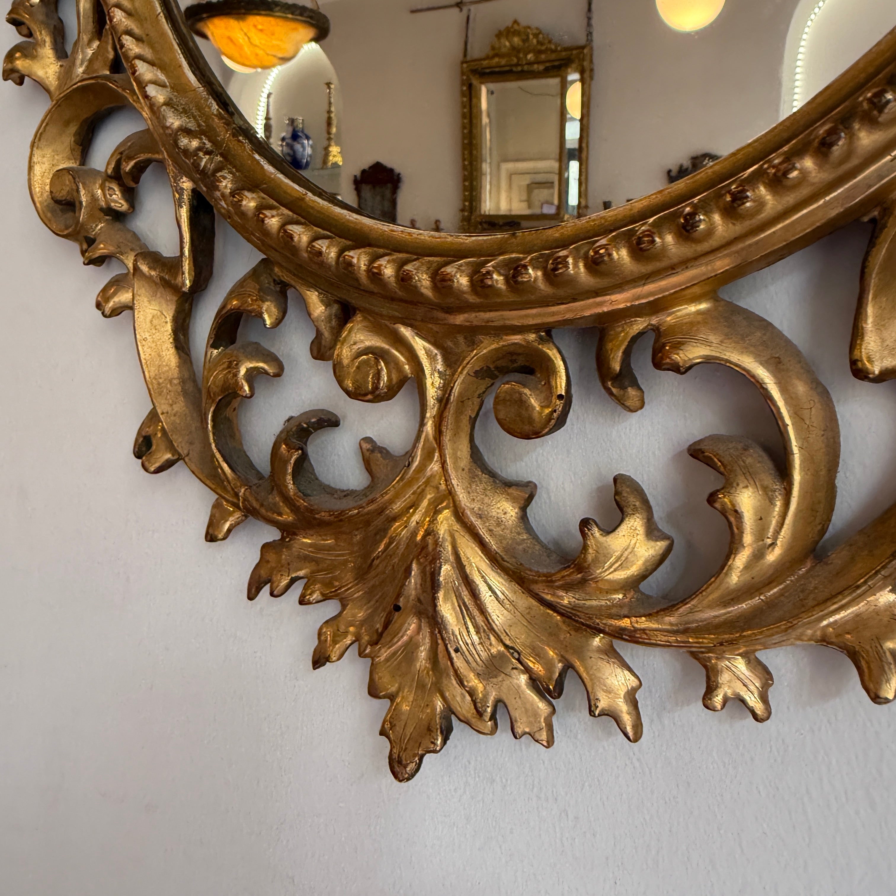 Pair of 19th century oval Florentine mirrors 