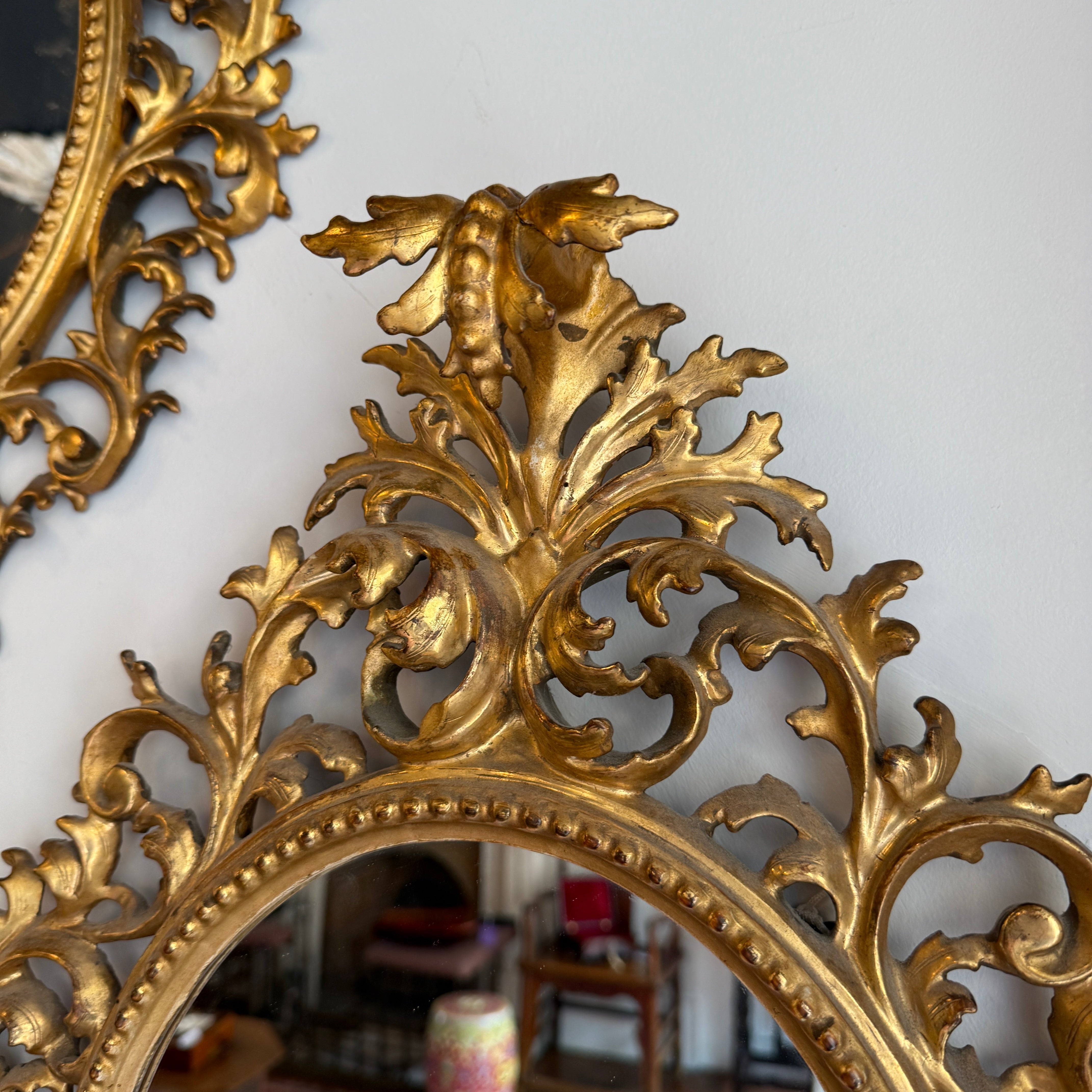 Pair of 19th century oval Florentine mirrors 