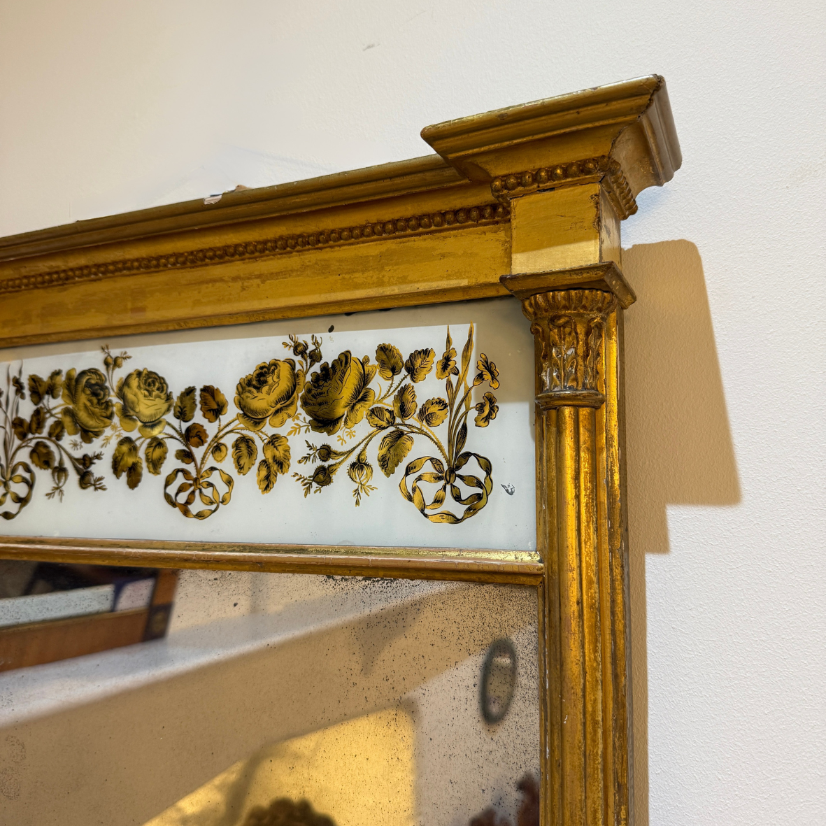 Late Regency gilt pier glass mirror with eglomise decoration circa 1825