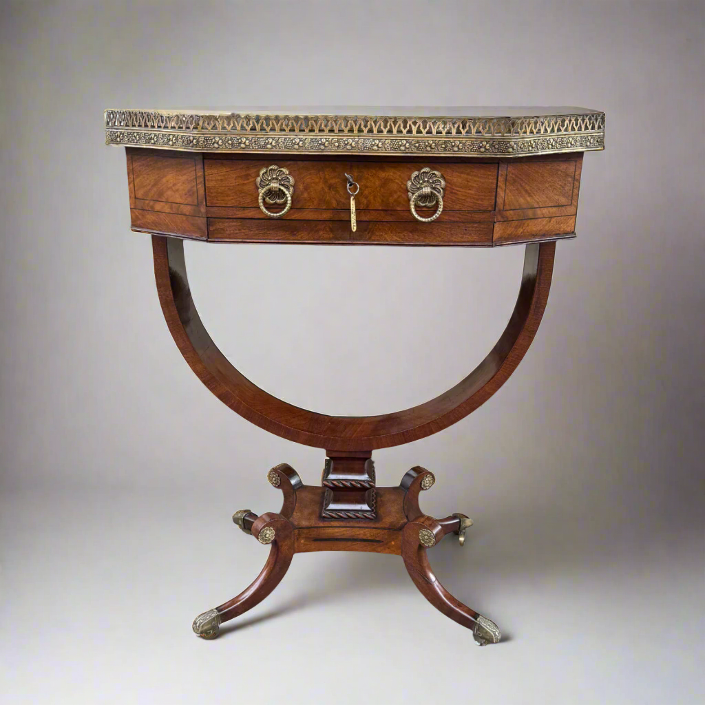 Regency mahogany and cross-banded work table with pierced brass gallery over a single drawer 
