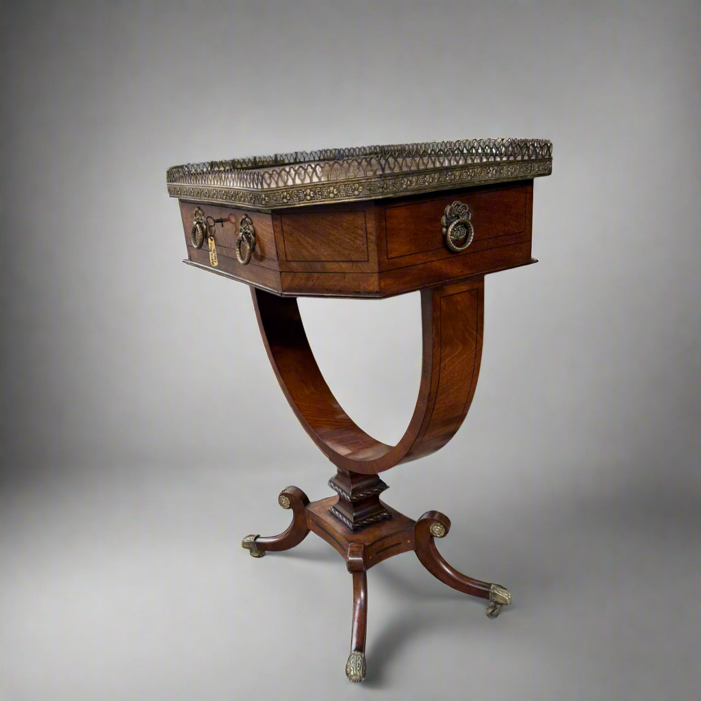 Regency mahogany and cross-banded work table with pierced brass gallery over a single drawer 
