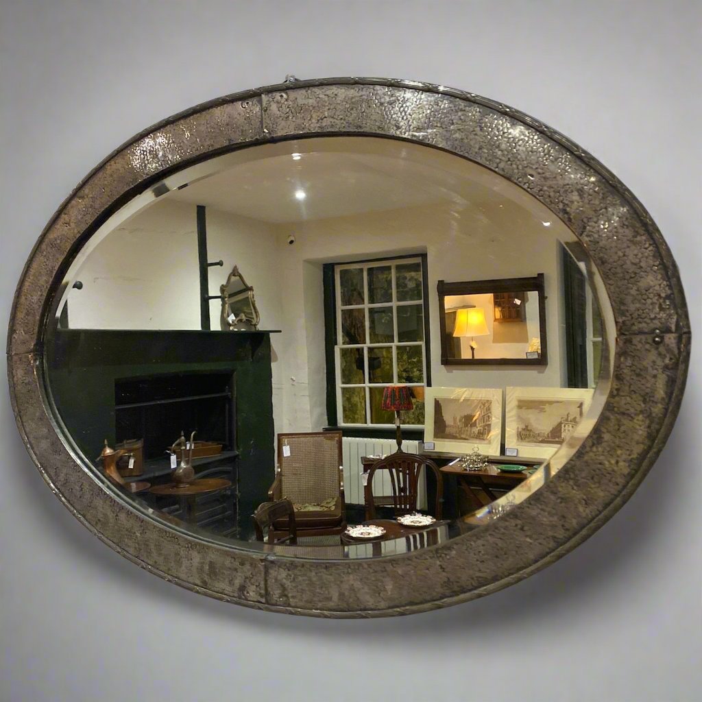 oval hammered metal mirror