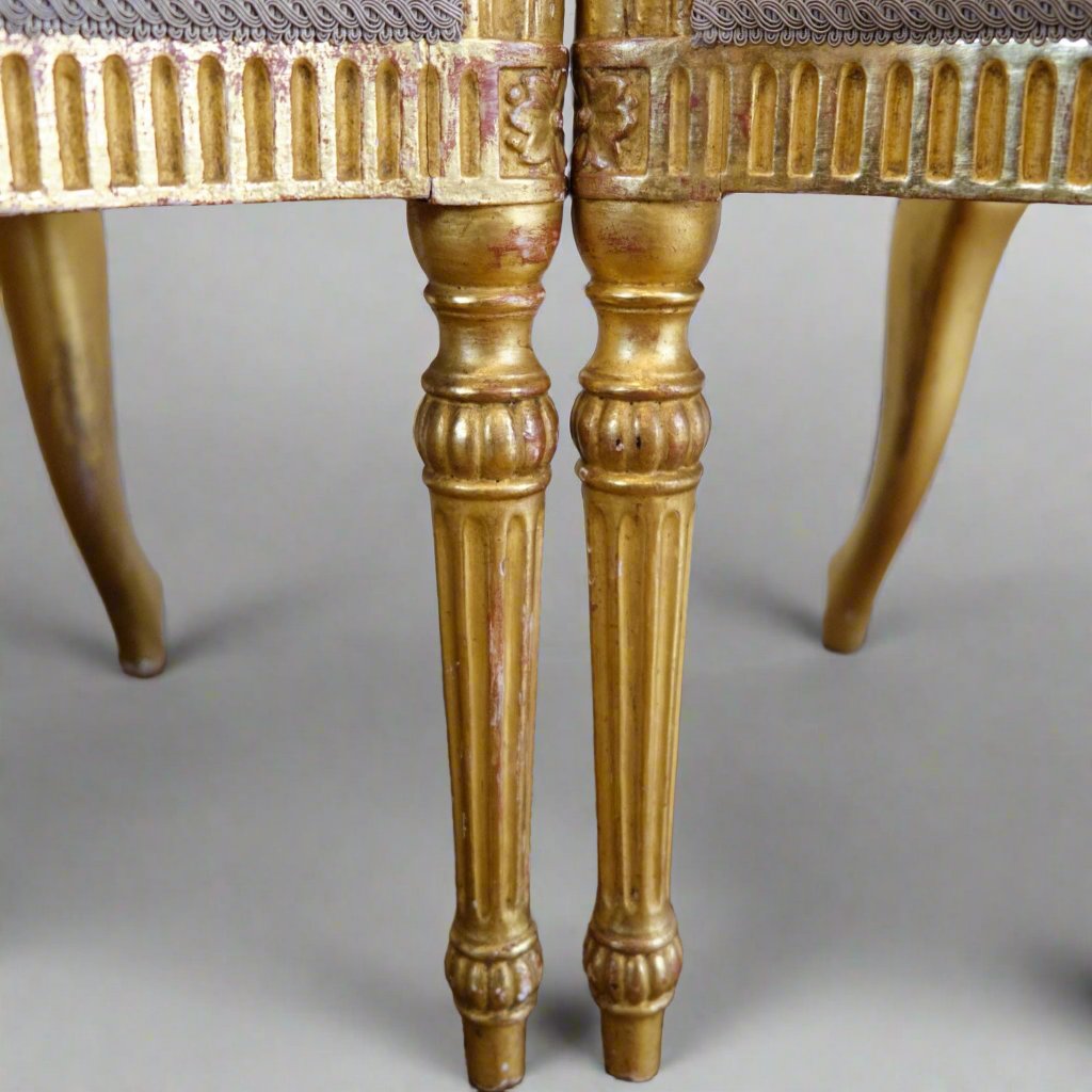 pair of gilded salon chairs detail