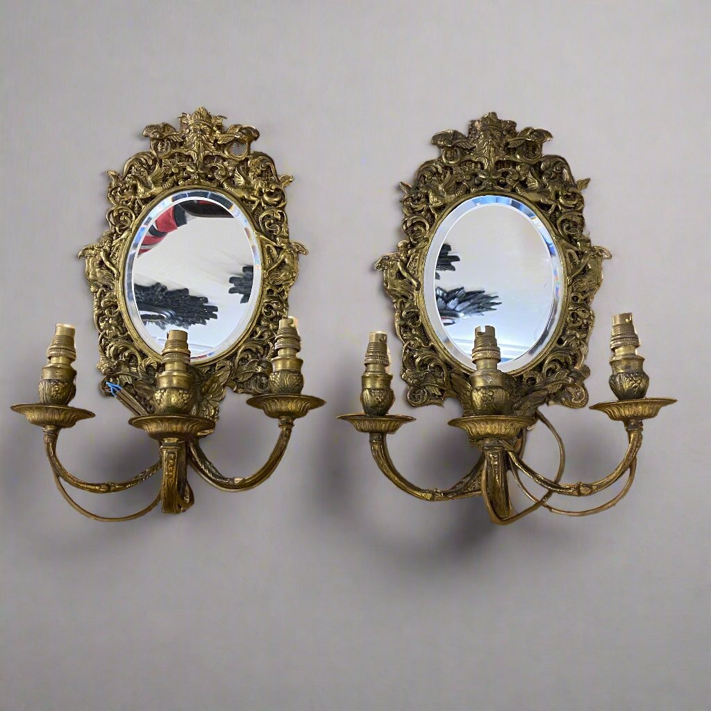 pair of mirrored sconces