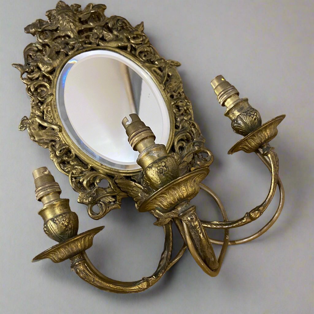 pair of mirrored sconces