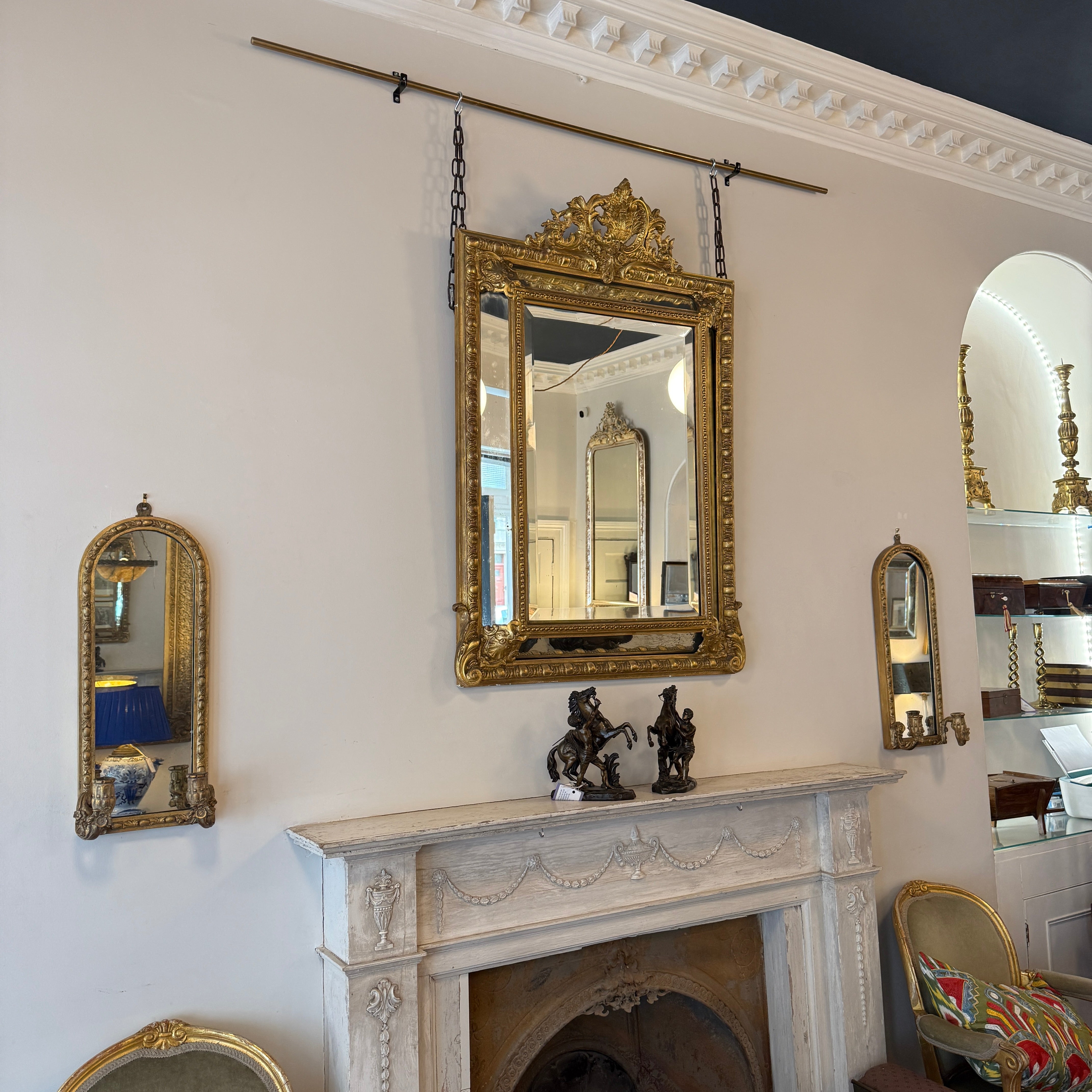pair of mirrors with curved top 